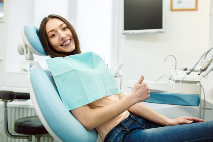positive-girl-dentist-s-chair